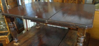 A turn of the century extending dining table