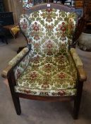 An unusual late nineteenth century country/provincial wingback armchair with studded upholstery in