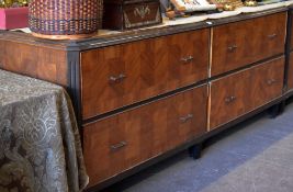 A four drawer department store cabinet composed of two pairs of side by side drawers with metallic