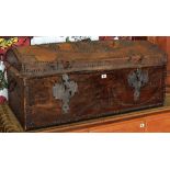 An antique dome studded leather trunk with large metal work escutcheons and having a floral fabric