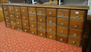 A thirty six drawer apothecary chest, 166cms wide x 58cms high