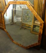 An octagonal faux bamboo framed mirror