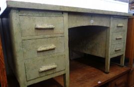 A vintage kneehole sponge painted desk of two flanks of three drawers each