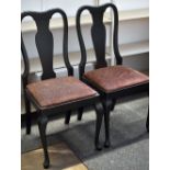 A set of six ebonised splat back dining/boardroom chairs