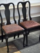 A set of six ebonised splat back dining/boardroom chairs