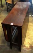 A drop leaf mahogany table and a corrugated garden bin