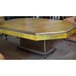 A large art deco style chrome and faux shagreen table, the octagonal top with chrome border and on a