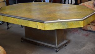 A large art deco style chrome and faux shagreen table, the octagonal top with chrome border and on a