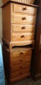 A pair of pine bedside cabinets and a wooden carry box