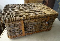 A good wicker laundry basket with leather straps