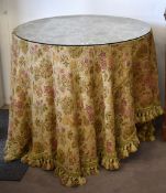 A circular glass topped occasional table (from Derry & Toms Department store, Kensington High