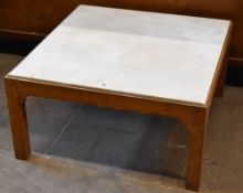 A square topped marble and wood table