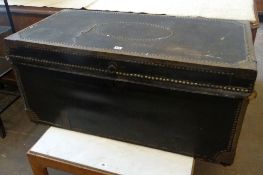 A vintage studded cabin trunk with floral painted interior circa 1890-1900