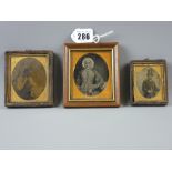 Three framed daguerreotype portraits, two depicting gentlemen in original frames, the other of an