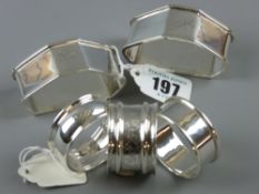 A pair of shaped silver napkin rings inscribed 'Gladys & Sid', 2 troy ozs, Birmingham 1946 and three