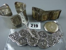 A lady's wristband stamped 925, a hallmarked silver circular locket with chased decoration and