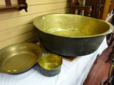 A very large antique brass bowl, 29 cms deep x 87 cms diameter, a 43 cms diameter brass bowl and