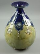 A Royal Doulton stoneware bulbous vase with flared collar, stylized trail work on a cobalt blue