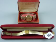A lady's cased yellow metal oval dial Montine wristwatch with incorporated bracelet and an