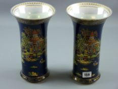 A pair of Carltonware Pagoda Vases, richly decorated in enamel colours and gilt highlighting,