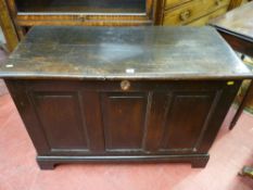 A late 18th Century oak dower chest having a triple fielded panel front on corner bracket feet,