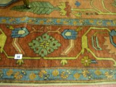 A large hand knotted carpet, 100% pile, made in India, wide bordered with large central medallion of