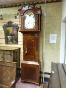 A good 19th Century inlaid mahogany wide cased longcase clock having a finial topped broken pediment
