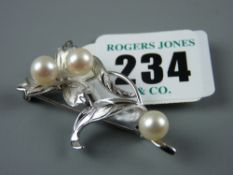 A silver leaf brooch with three pearls, 4.8 grms gross