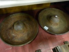 A pair of circular cast iron feeding troughs with raised dome centres, 68 cms diameters