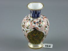 A 19th Century Royal Crown Derby baluster vase in typical Imari palette with gilt highlighted panels