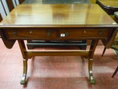 An early reproduction mahogany sofa table having twin flaps, two opening drawers, centre stretcher