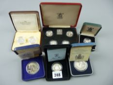 A cased Royal Mint five coin one pound set 1984-1987, a cased Royal Mint 1989 two pound silver