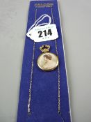 A nine carat gold framed photo pendant and a nine carat gold fine neck chain