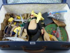 A vintage suitcase and contents to include a Boy Scout uniform, a felt monkey and horse, a