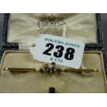 A nine carat gold bar brooch with three aquamarines and three pearls, 3.8 grms gross