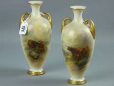 A pair of Royal Worcester twin handled vases, hand painted with scenes of Highland Cattle by J