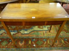 A reproduction yew oblong topped foldover baize lined card table, the top having a fine oval shell