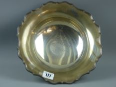 A Chester hallmarked silver footed bowl, 25.5 cms diameter approximately with shaped rim,