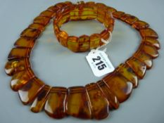 An amber necklace and bracelet, the necklace having graduating natural form polished segments with