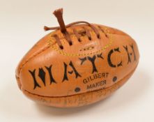 A MINIATURE LEATHER GILBERT RUGBY BALL SIGNED BY WALES & IRELAND players from the 1980s including