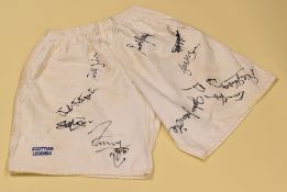 PAIR OF RUGBY SHORTS SIGNED BY APPROXIMATELY 28 VARIOUS PLAYERS worn in a special commemorative