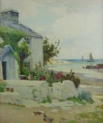 JOHN McDOUGAL watercolour - cottage with colourful garden flowers by the inlet at Cemaes Bay, signed