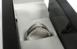 A PRINCESS-CUT DIAMOND & 18ct WHITE GOLD RING accompanied by 2012 insurance certificate stating