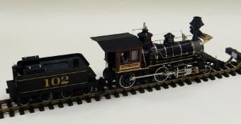 A LARGE MODEL OF A STEAM TRAIN AND TENDER 'KANSAS CENTRAL'