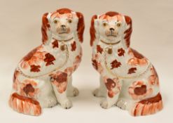 A GOOD PAIR OF STAFFORDSHIRE RED AND WHITE SEATED DOGS with gilded collars, padlocks and leads