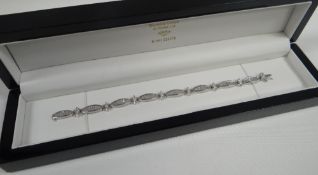 DIAMOND & PLATINUM BRACELET, claw and channel set with marquise and baguette cut diamonds, 2012