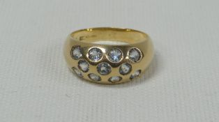 18ct GOLD BAND RING SET WITH ELEVEN DIAMONDS, 5.5gms