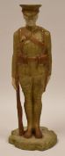 ROYAL WORCESTER FIGURE OF A STANDING WWI ARMY OFFICER in blush glaze with rifle, standing to