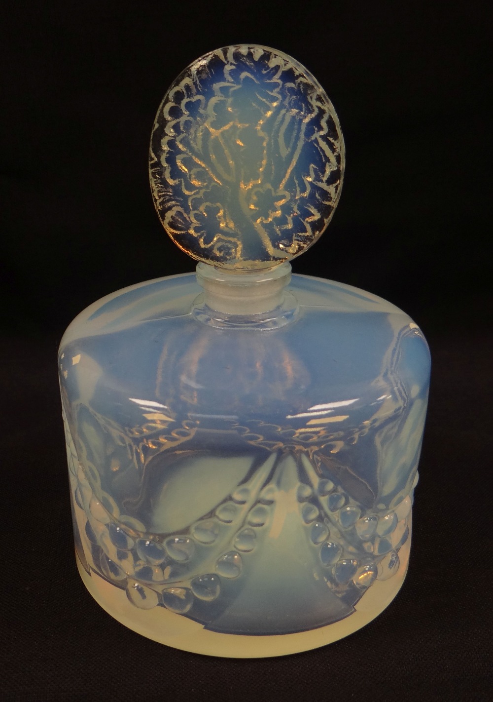 A SABINO OPALESCENT GLASS SCENT BOTTLE of circular form with oval naturalistic stopper and with