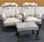 A PAIR OF HOWARD STYLE ARMCHAIRS for re-upholstering together with a cross stitched cushioned